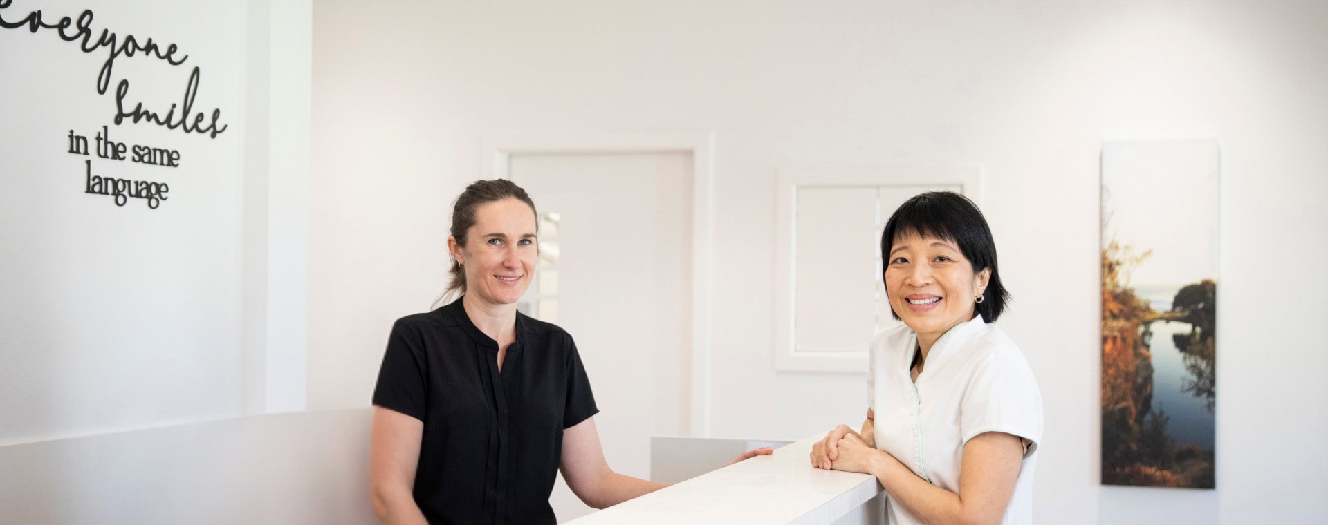 Dr Elaine discusses dental services with one of Richmond Road Dental's friendly reception staff